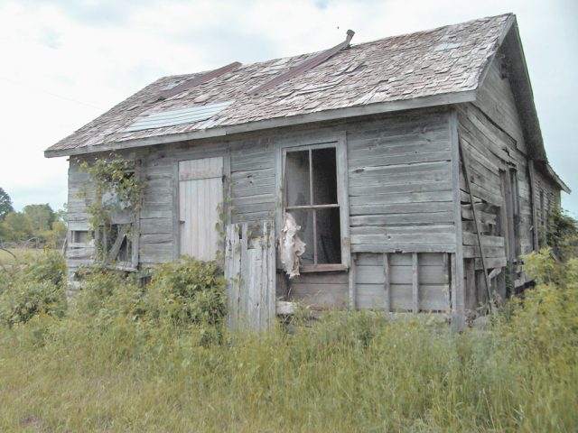Derelict weathered wooden house