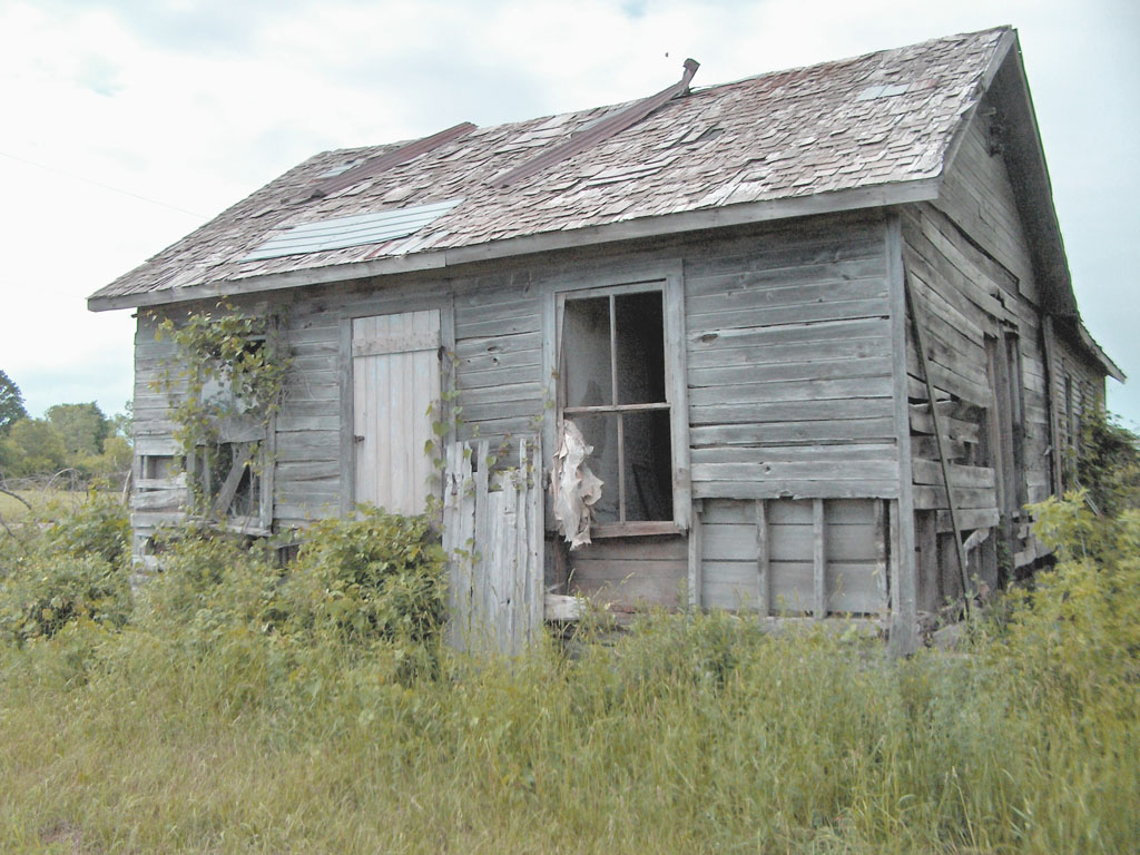 Derelict weathered wooden house